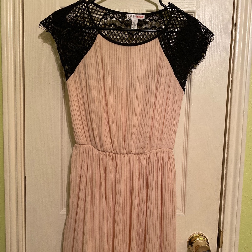 A beige black cocktail dress